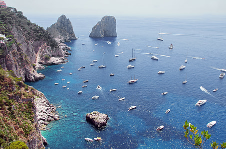 high angle photo of boats near on islet thumbnail