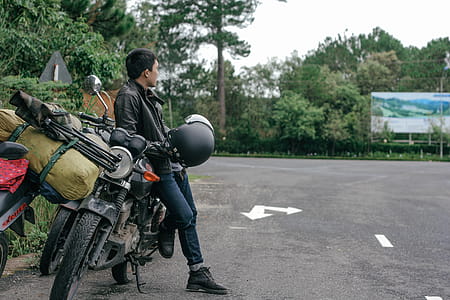 Photo of Man Sitting on Motorcycle thumbnail