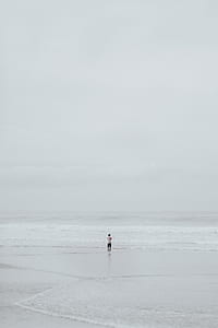 man standing on seashore thumbnail