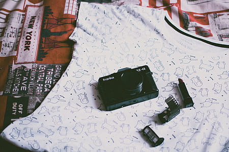 Black Camera on Top of Clothes thumbnail