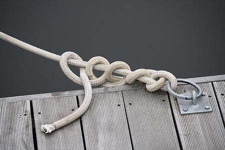 close up photo of white rope tie on buckle thumbnail
