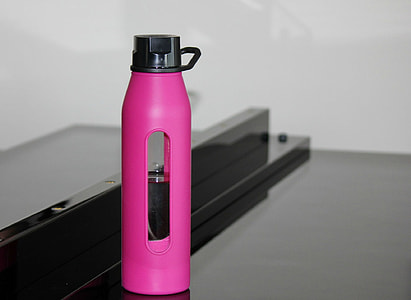 selective focus photography of pink and black tumbler thumbnail