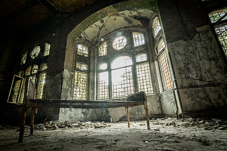 brown metal bed in concrete building during daytime thumbnail
