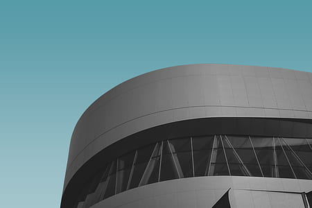 low-angle photography of gray architectural building during daytime thumbnail