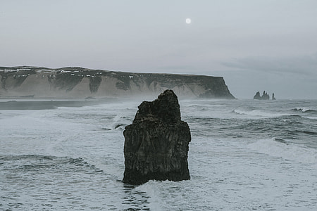 black rock formation at sea thumbnail