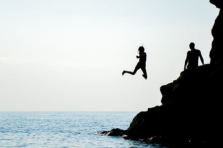 person jumping into body of water thumbnail