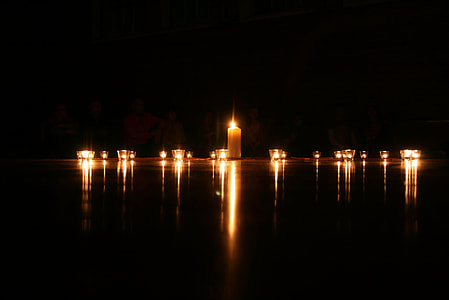 lighted candles with black background thumbnail