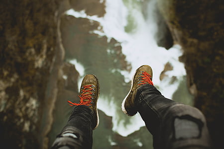 person showing pair of green-and-white shoes thumbnail