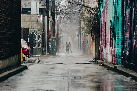 Couple Walking Through Graffiti Alley Photo thumbnail