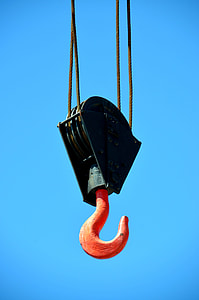 low-angle photography of black and orange pulley with hook thumbnail