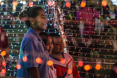 woman and two children taking photo thumbnail