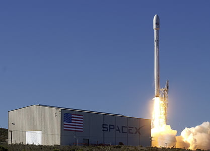 white rocket launch at daytime thumbnail
