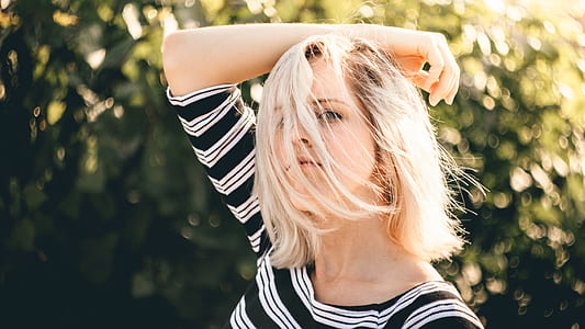 woman putting her arms on her head pose for a photo shoot thumbnail