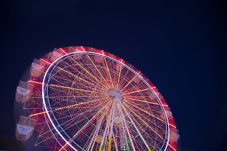 white and red ferris wheel during night thumbnail