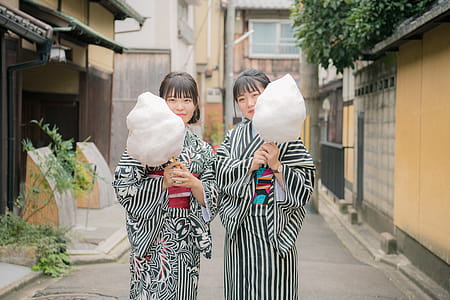 Photo of Women Holding Cotton Candy thumbnail
