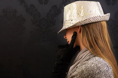 woman in gray top wearing hat thumbnail