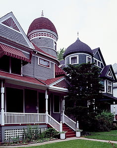 gray and brown house beside tree thumbnail