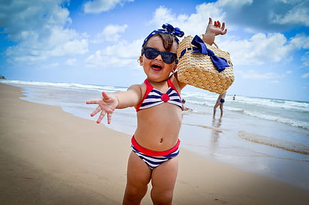 girl wearing black, white, and red 2-piece swimsuit at daytime thumbnail