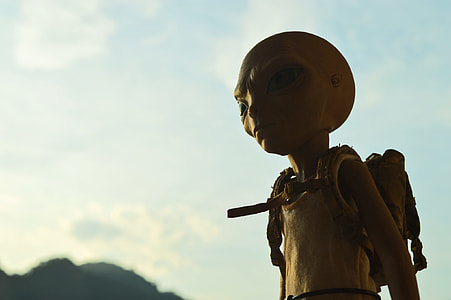 alien wearing white sleeveless shirt with backpack thumbnail