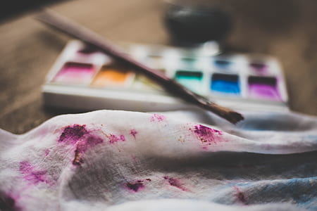 white textile with purple stain thumbnail