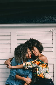 two woman hugging each other thumbnail