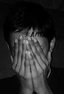 boy hand covered face thumbnail
