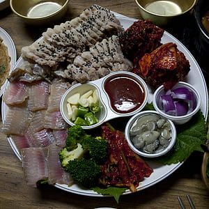 raw foods served in white round tray thumbnail