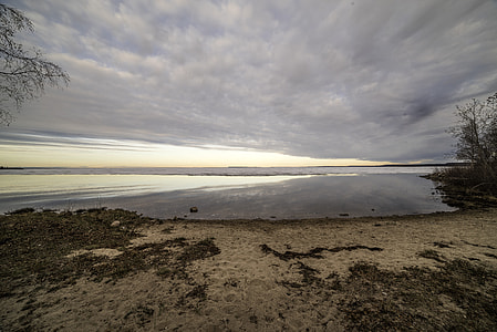 Beach and Great Slave lake under dramatic clouds thumbnail