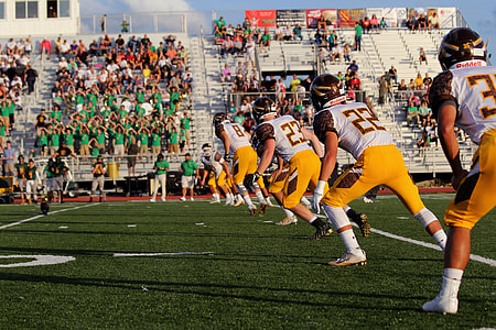 football players on field during daytime thumbnail