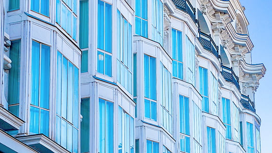 low angle photo of blue buildings thumbnail