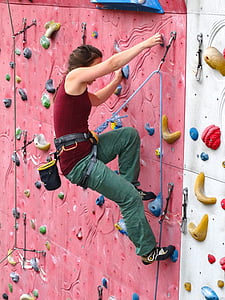 photo of woman in red tank top doing wall climbing thumbnail