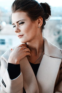 portrait photography of brown peaked lapel suit jacket looking sideways thumbnail