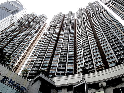 low angle photography of gray high-rise building thumbnail