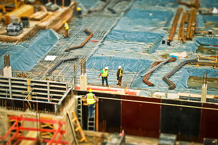 two man standing on top of construction building thumbnail