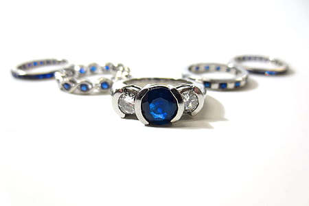 close-up silver-colored blue and clear crystal encrusted ring thumbnail