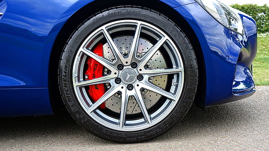 chrome-colored multi-spoke vehicle wheel and tire thumbnail