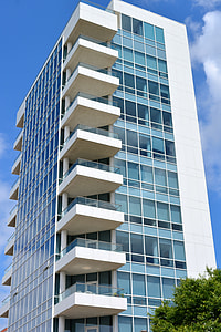 low-angle photo of white concrete curtain-wall building thumbnail