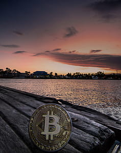 Body of Water during Dawn With Bitcoin Logo Text Overlay thumbnail