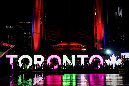 people silhouette near Toronto decor at nighttime thumbnail