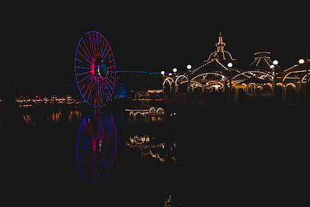 panoramic photography of blue and pink ferris wheel during nighttime thumbnail