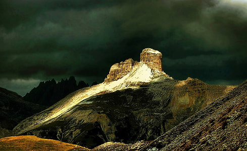 rock formation under black clouds thumbnail