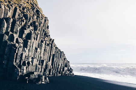 rock formation cliff near sea shore thumbnail
