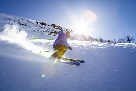 man skiing on snow field thumbnail