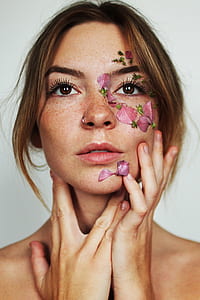 woman with floral face artwork thumbnail
