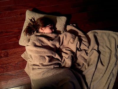 girl sleeping on brown pillow thumbnail