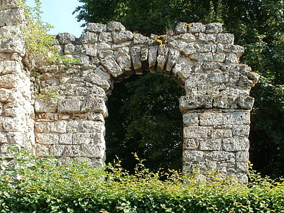 gray concrete arch near trees thumbnail