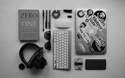 zero one book besides pens and Apple Magic keyboard thumbnail