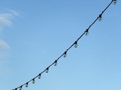 black string lights under blue sky thumbnail