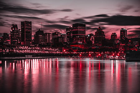 skyline photography of buildings near body of water thumbnail