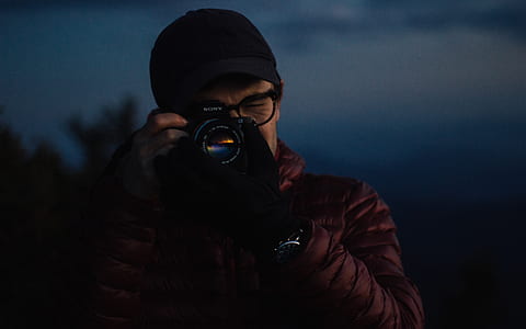 person using DSLR camera thumbnail